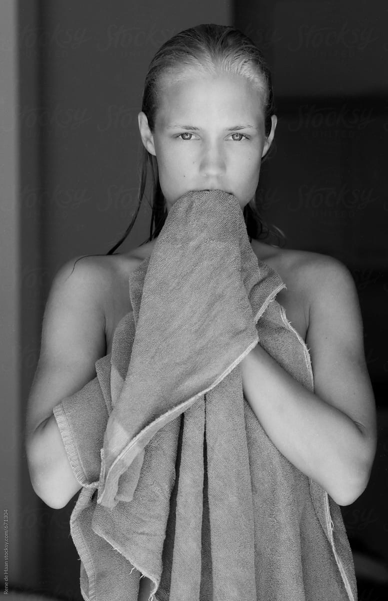 young woman covering herself with towel