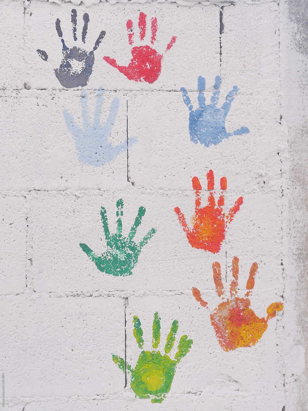 White background with colorful handprints