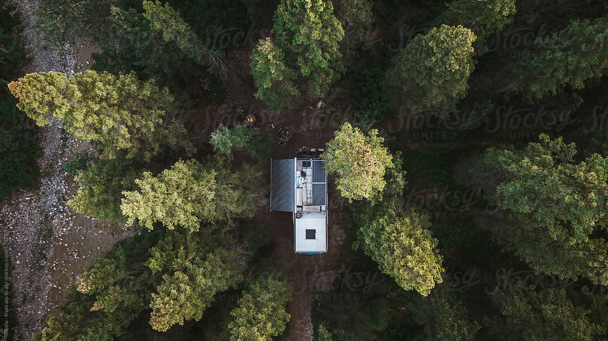 camper van in green forest