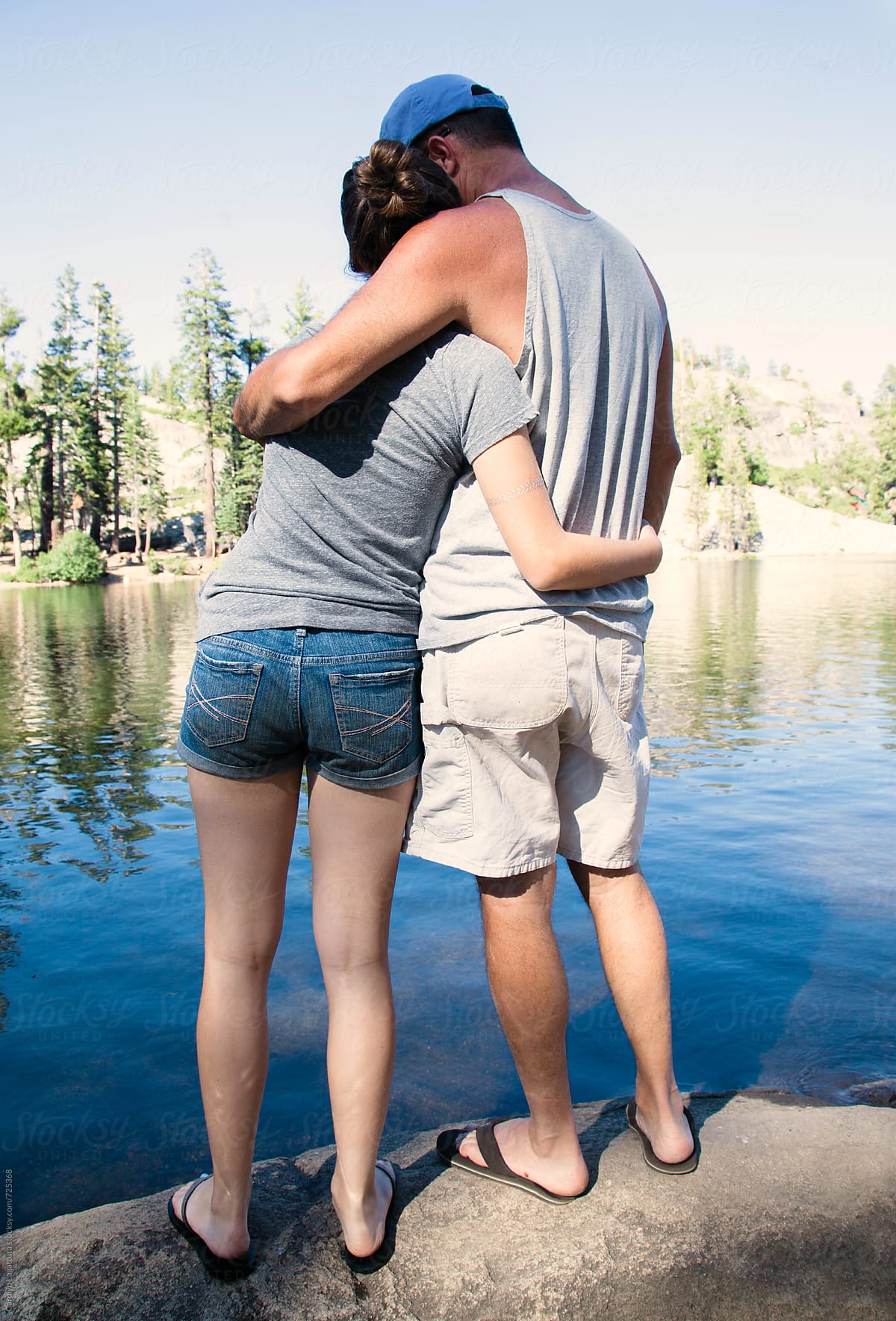 Father And Daughter Embracing By A Lake In The Sierras By Stocksy Contributor Carolyn