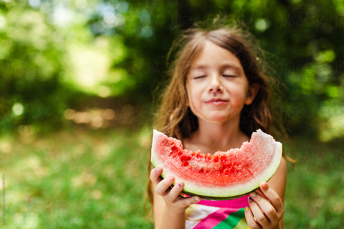 Child enjoys eating watermelon