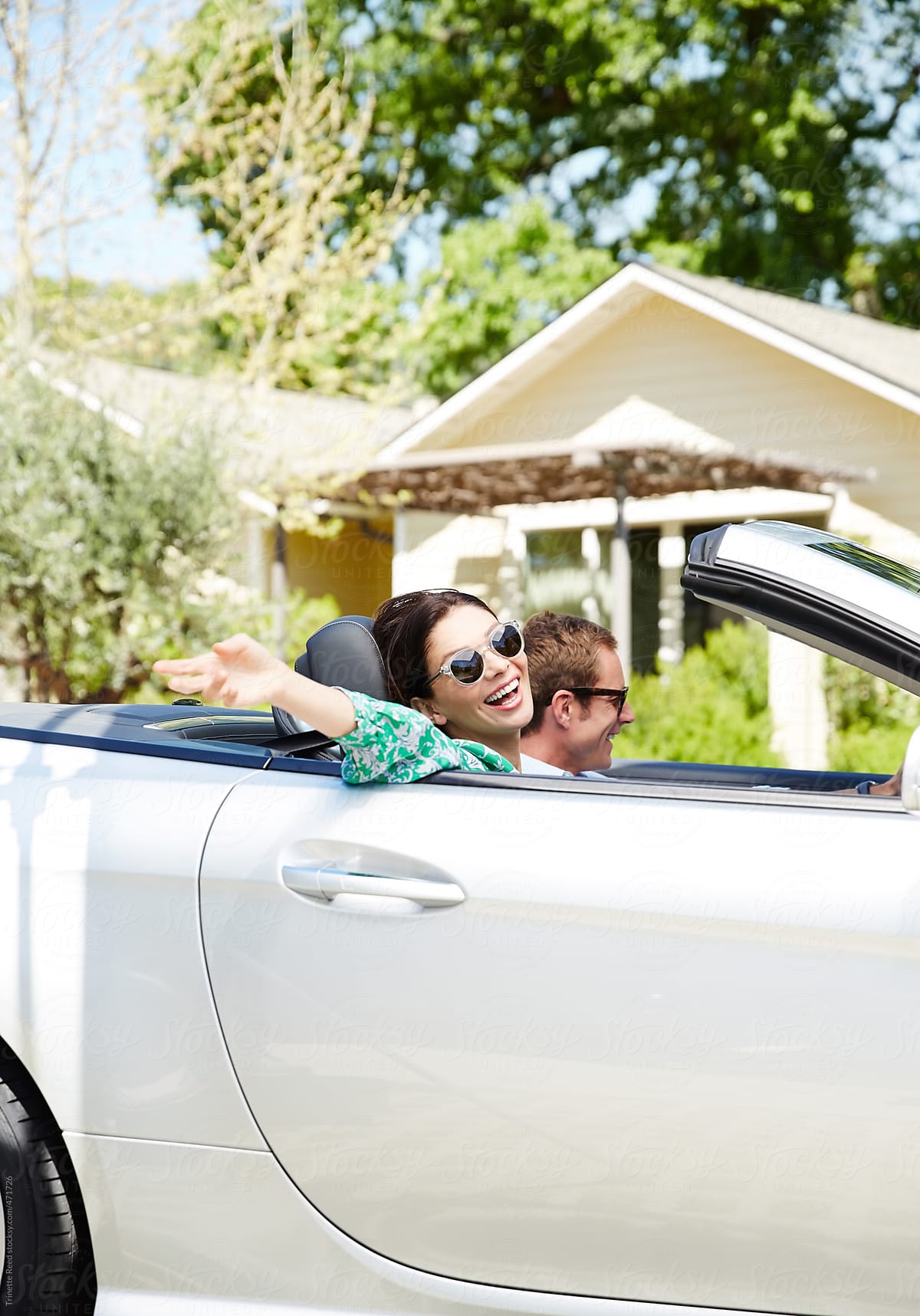 Couple on vacation In Convertible car