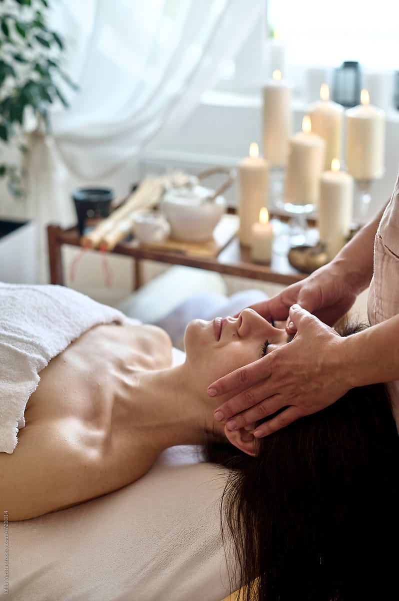 Woman receiving a relaxing head massage