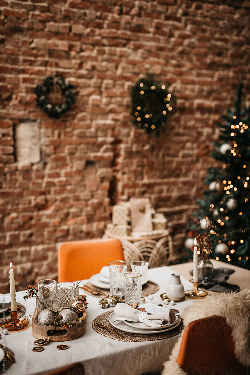 Close up of a Christmas table set with warm theme