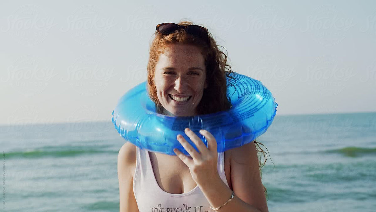 Portrait Of Happy Redhead Girl By The Sea By Stocksy Contributor Guille Faingold Stocksy 