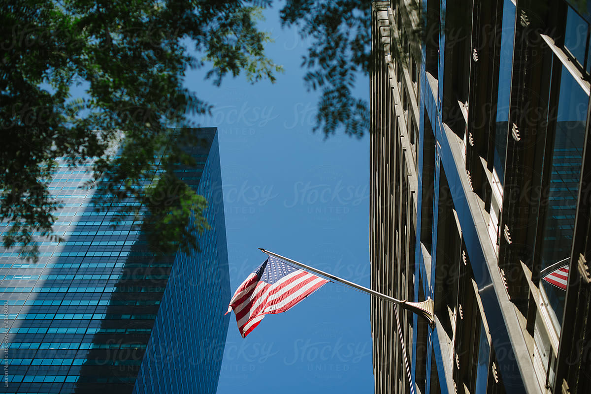 American flag swinging between buildings