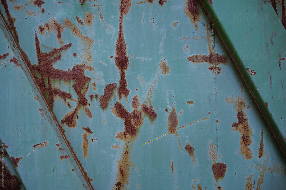 Old scratched rusty blue metal panel