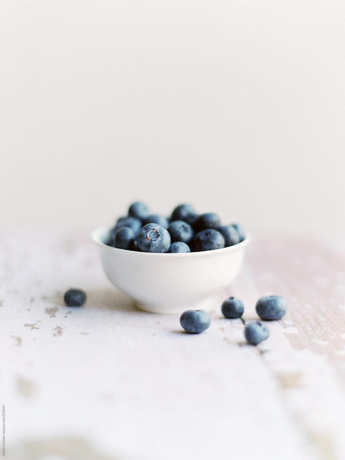 White bowl with fresh blueberries