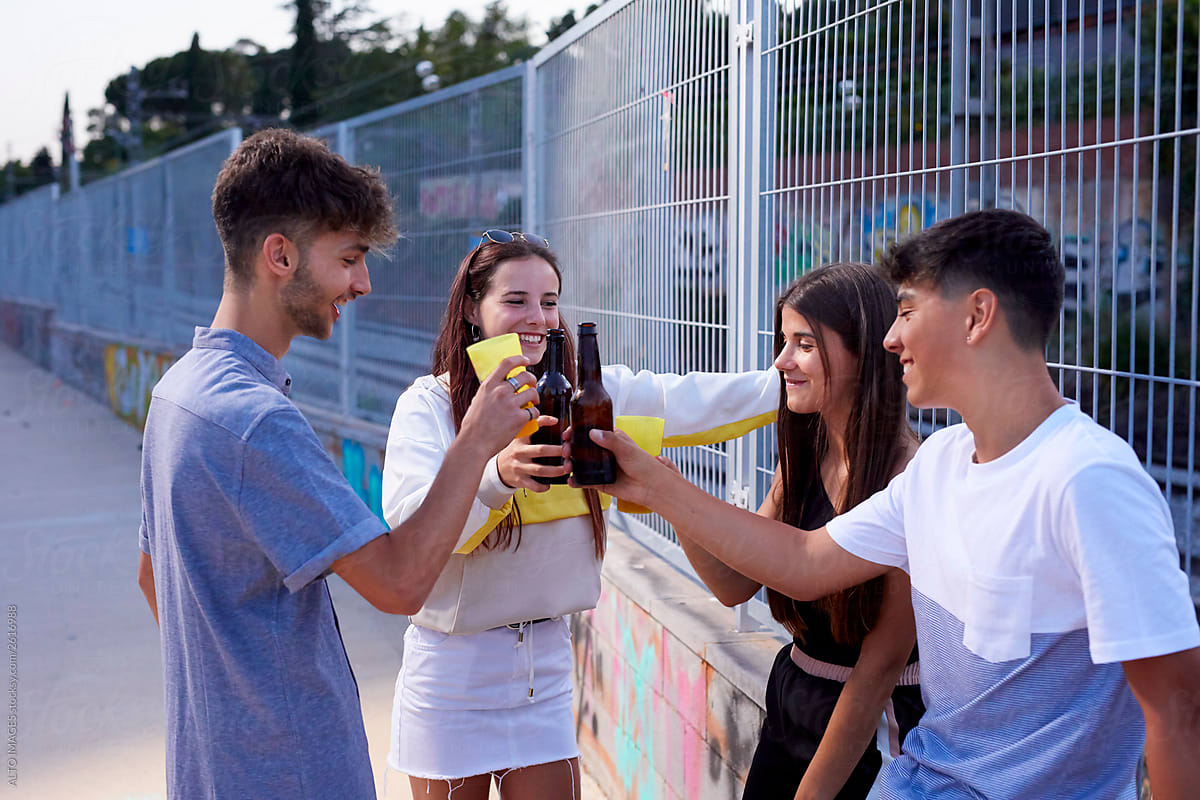 Teenagers making a toast drinking alcohol