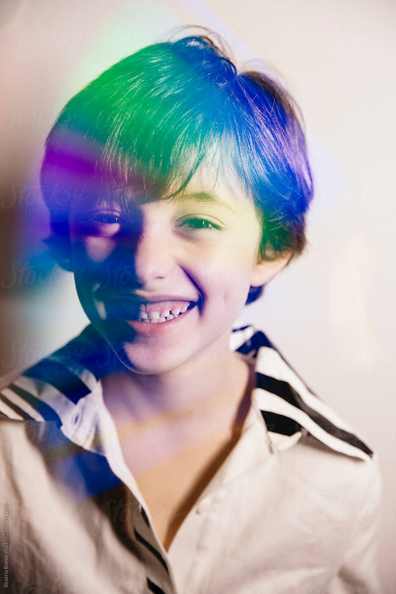 Double exposure of colorful reflection on boy\'s portrait