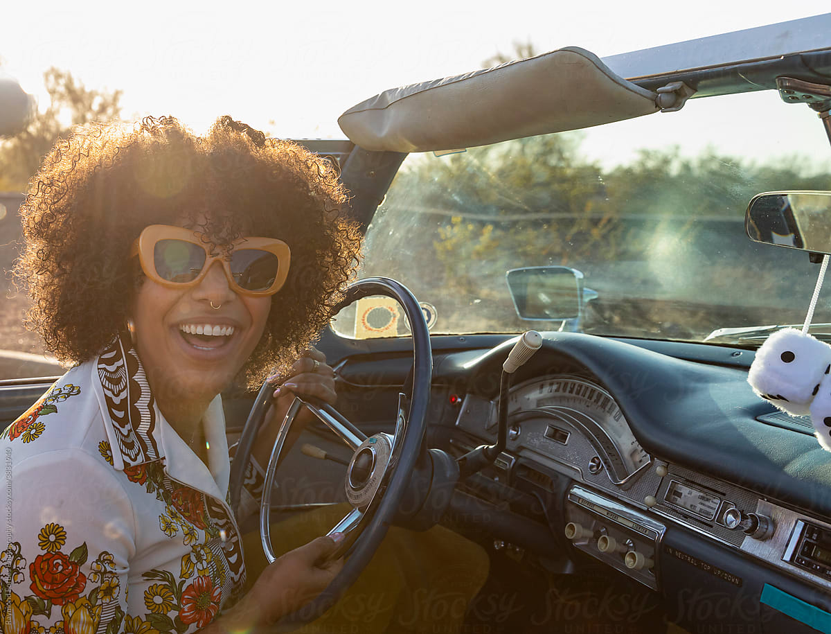 Happy Gorgeous Black woman with Big smile in Car