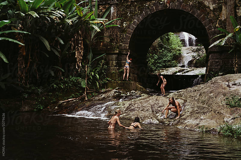 A group of adventurous females explore a hidden lagoon in Brazil