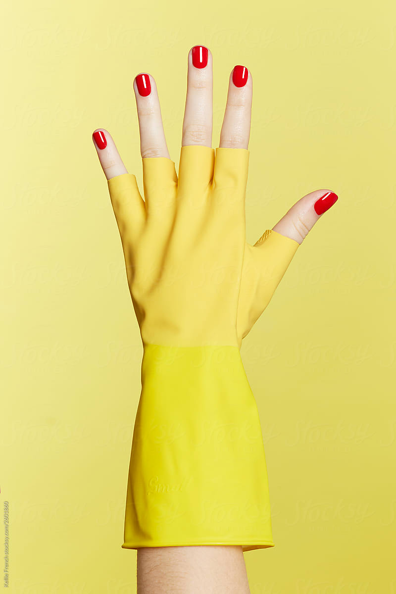 Painted nails and rubber glove
