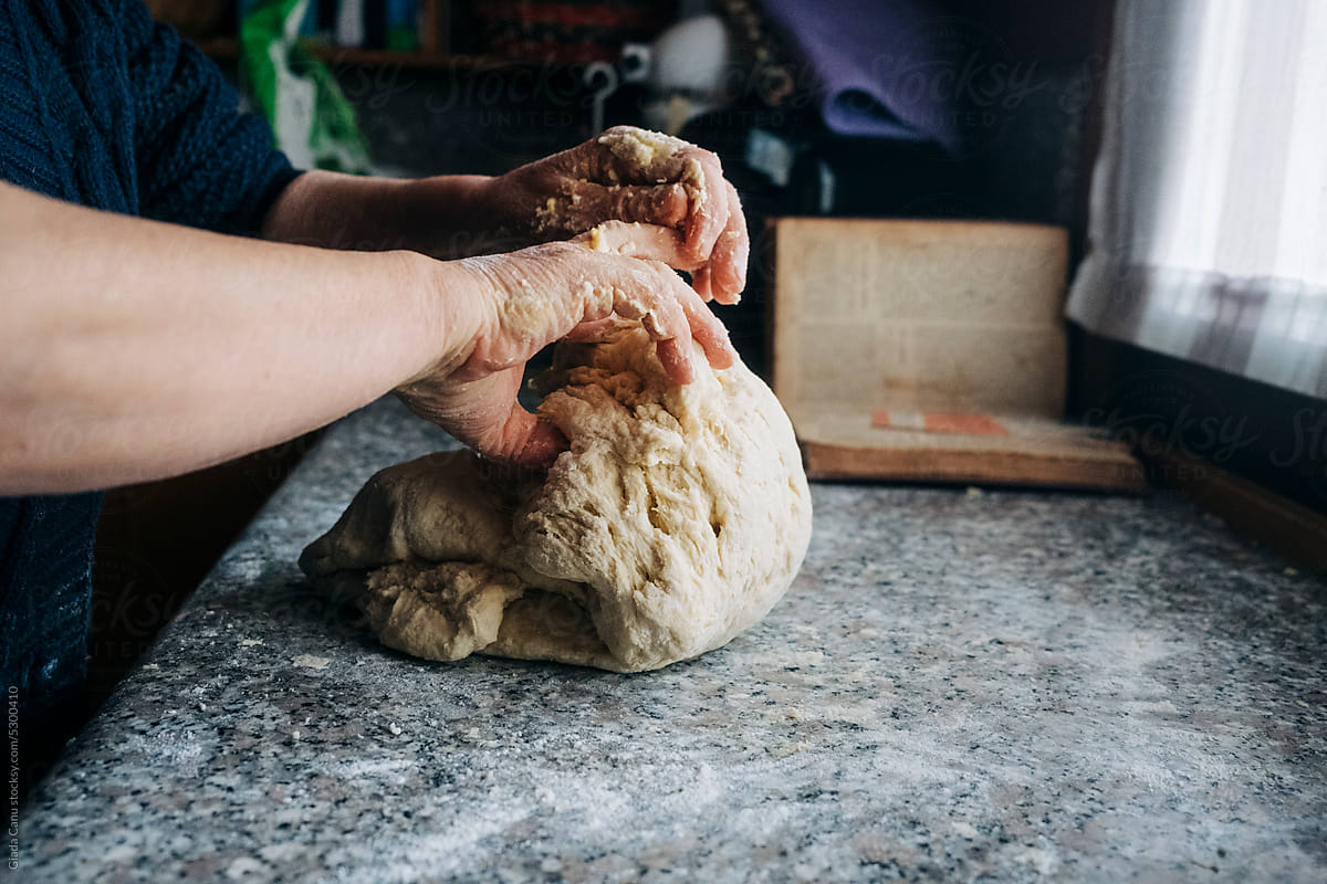 woman mixing dough