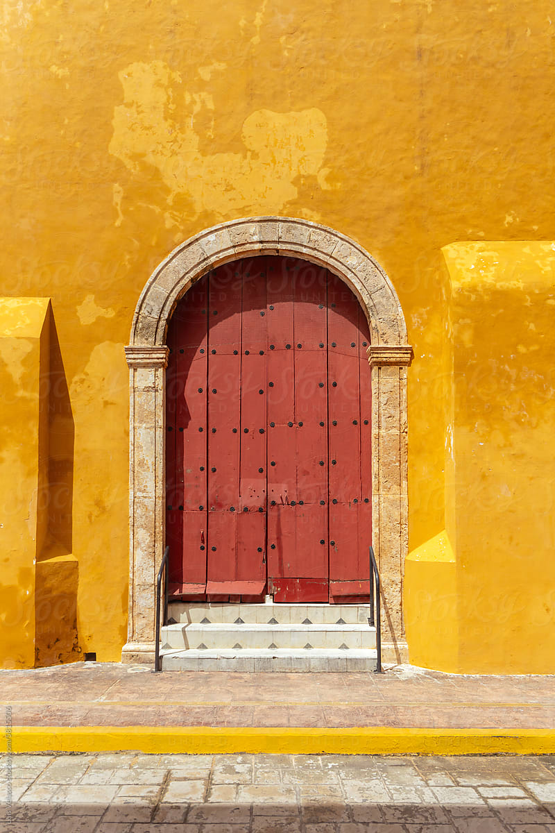 Yellow Wall And Red Door Of A Colonial Church In Campeche, Mexico.