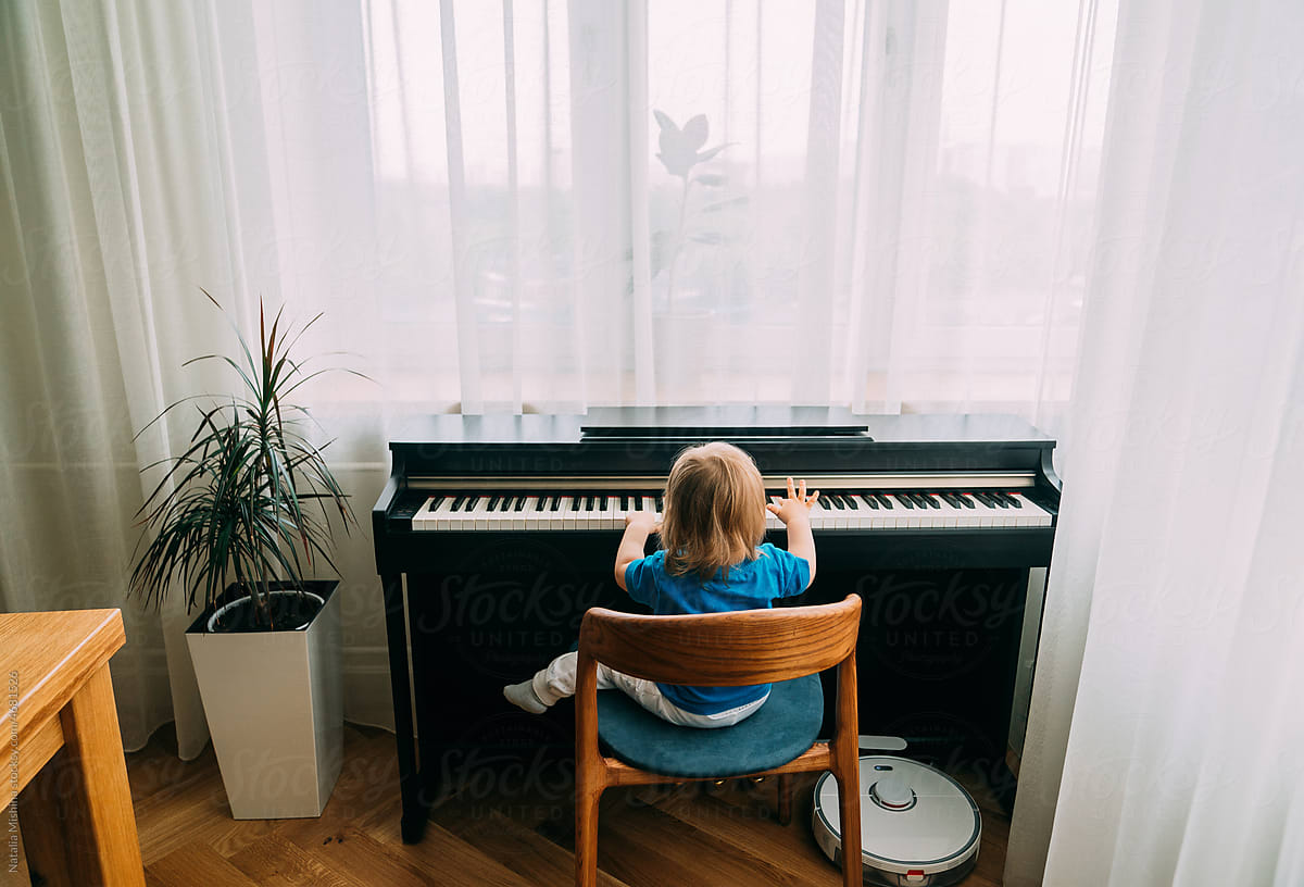 A boy plays the piano.