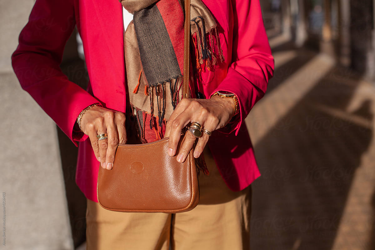 mature fashion woman hands opening purse