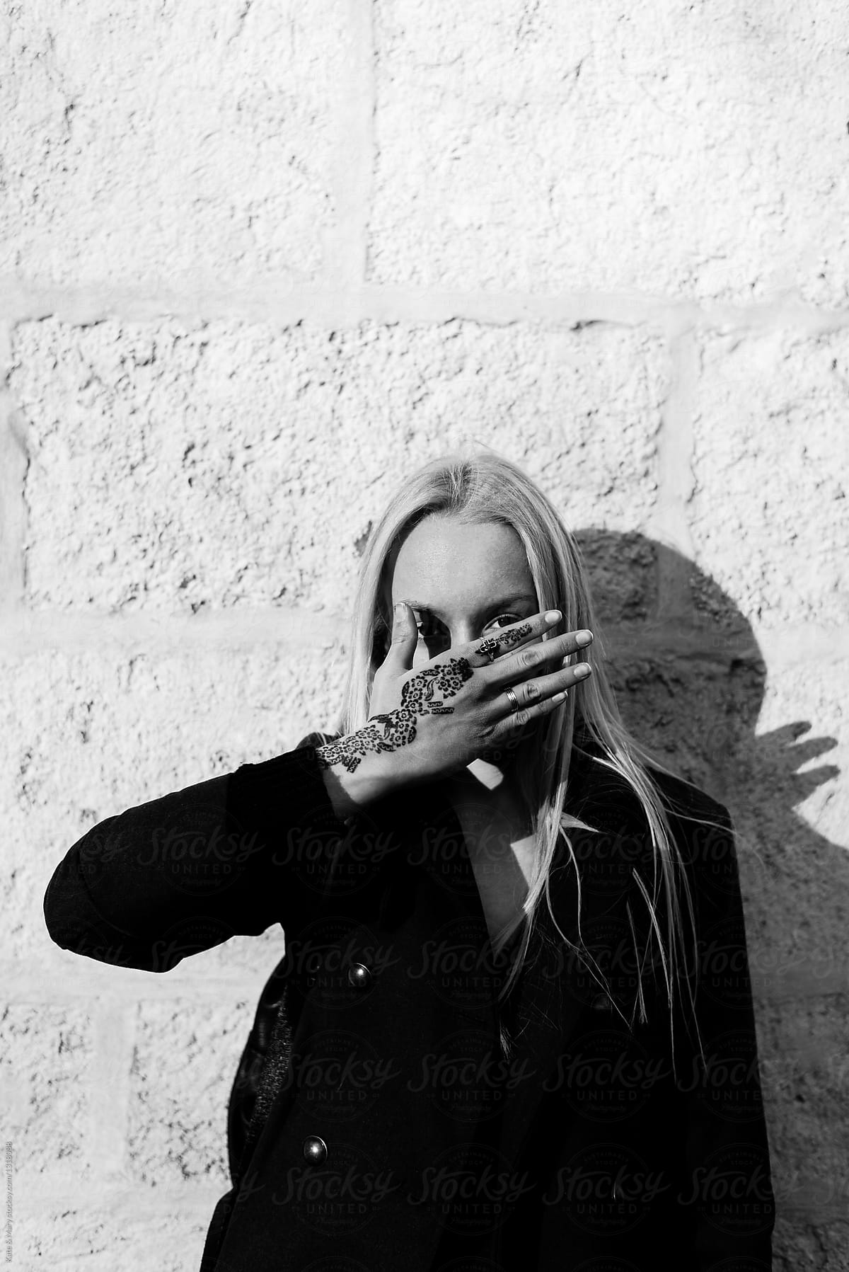 Woman Hiding Her Face With Hand By Stocksy Contributor Katarina