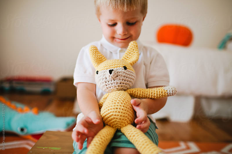 Boy with crocheted stuffed animal