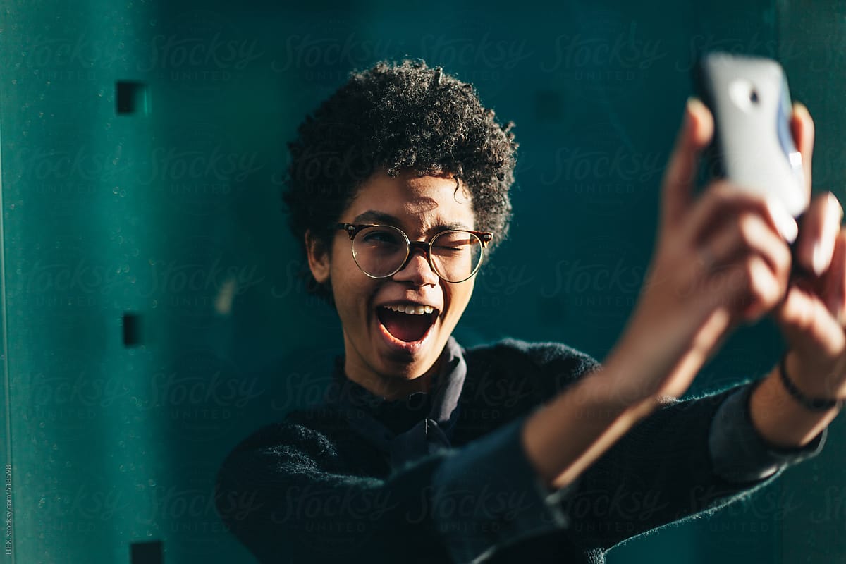 Funny Black Woman Taking Self Portrait with Mobile Phone