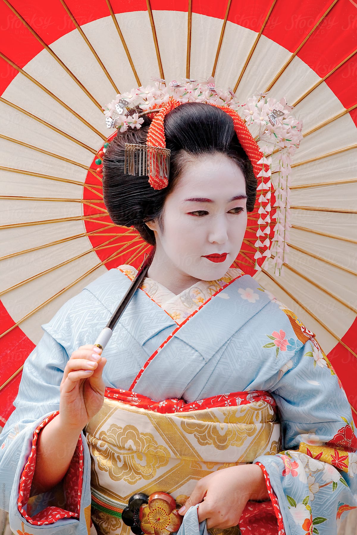Asia, Japan, Honshu, Kansai Region, Kyoto, Gion district, portrait of a Geisha wearing a tradional Kimono and holding an umbrella