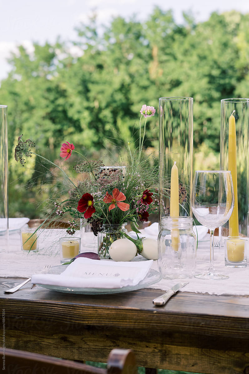 View of a decorated dinner table outdoors In summer