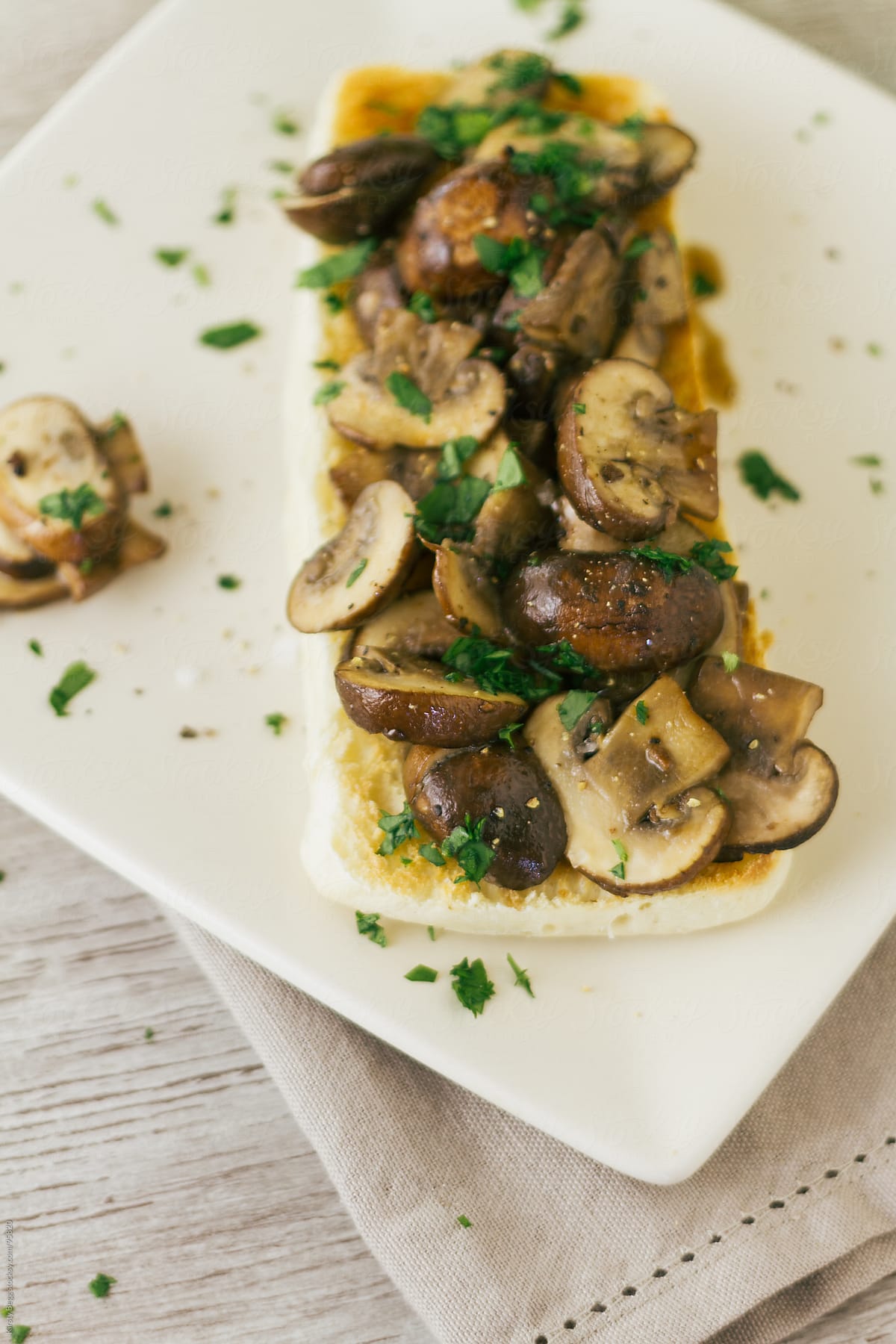 Garlic mushroom bruschetta on plate vertical