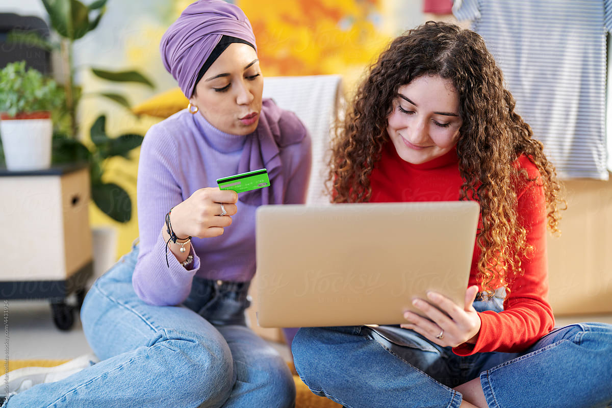 Diverse women shopping online at home
