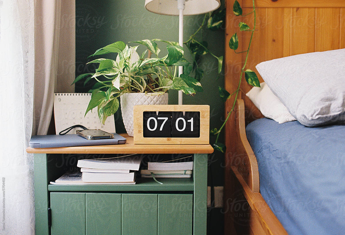 Bedroom with a wooden alarm clock
