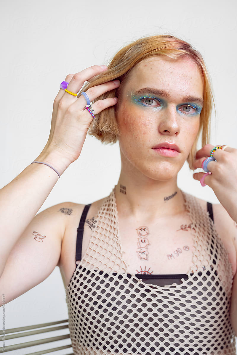 Portrait Of A Non-Binary Man With Glitter Makeup