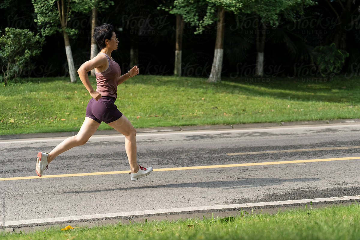 Asian woman running