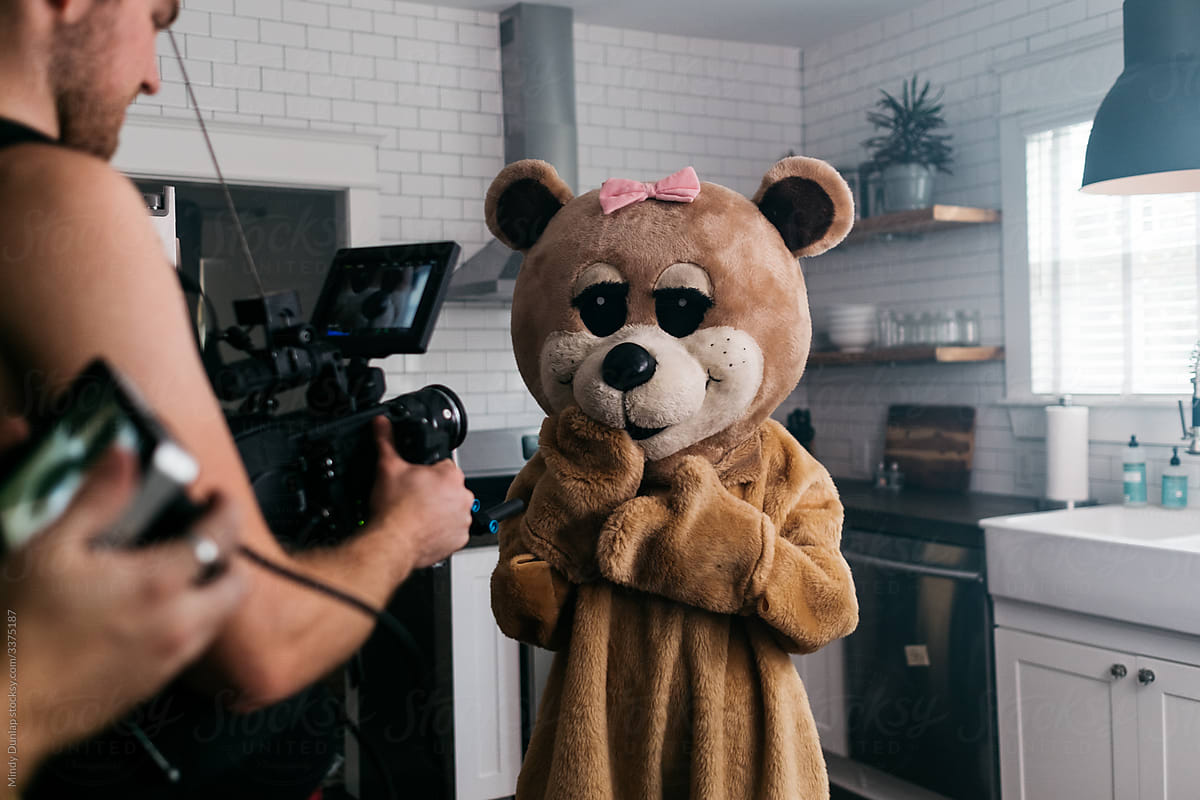 Female bear costume gets filmed by Mindy Lopez Dunlap for Stocksy United