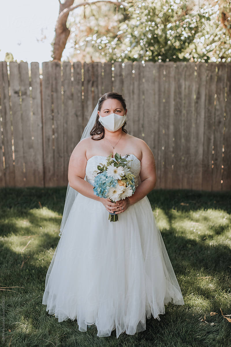 Bride Wearing Mask at Wedding during COVID Pandemic