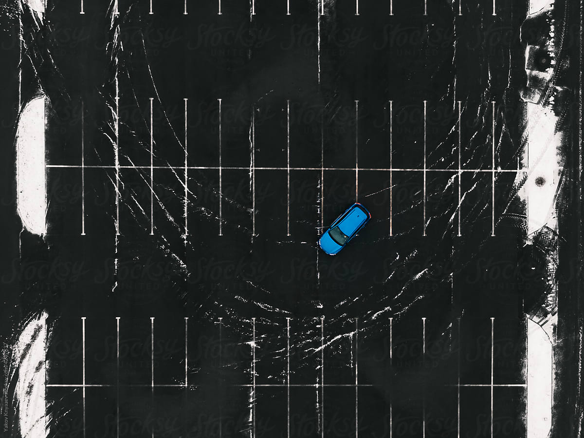 blue sedan car at the parking, drone overhead view