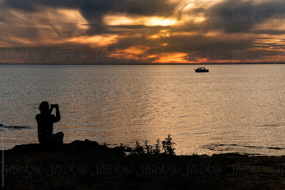 Woman Photographing a Sunset over Port Phillip Bay