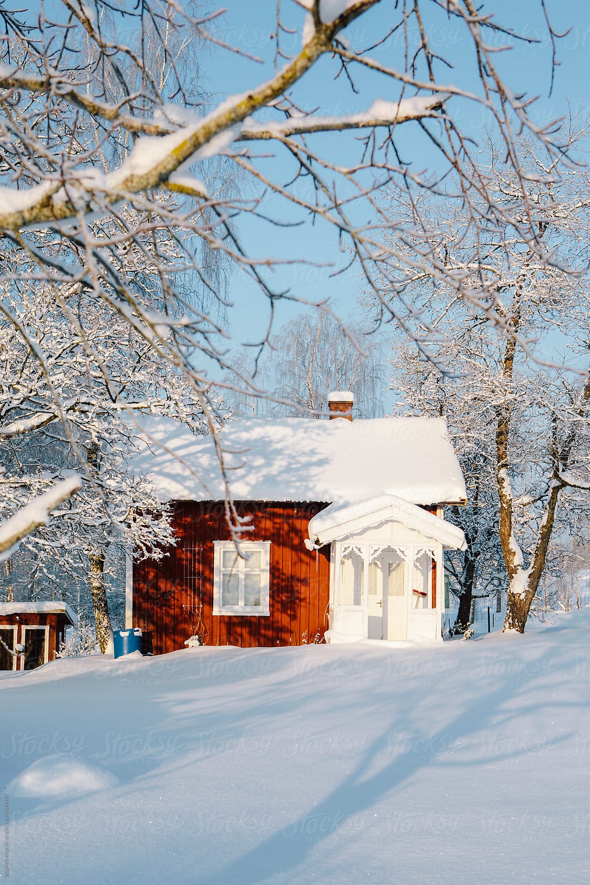 Red Swedish Cottage in Snowy Landscape