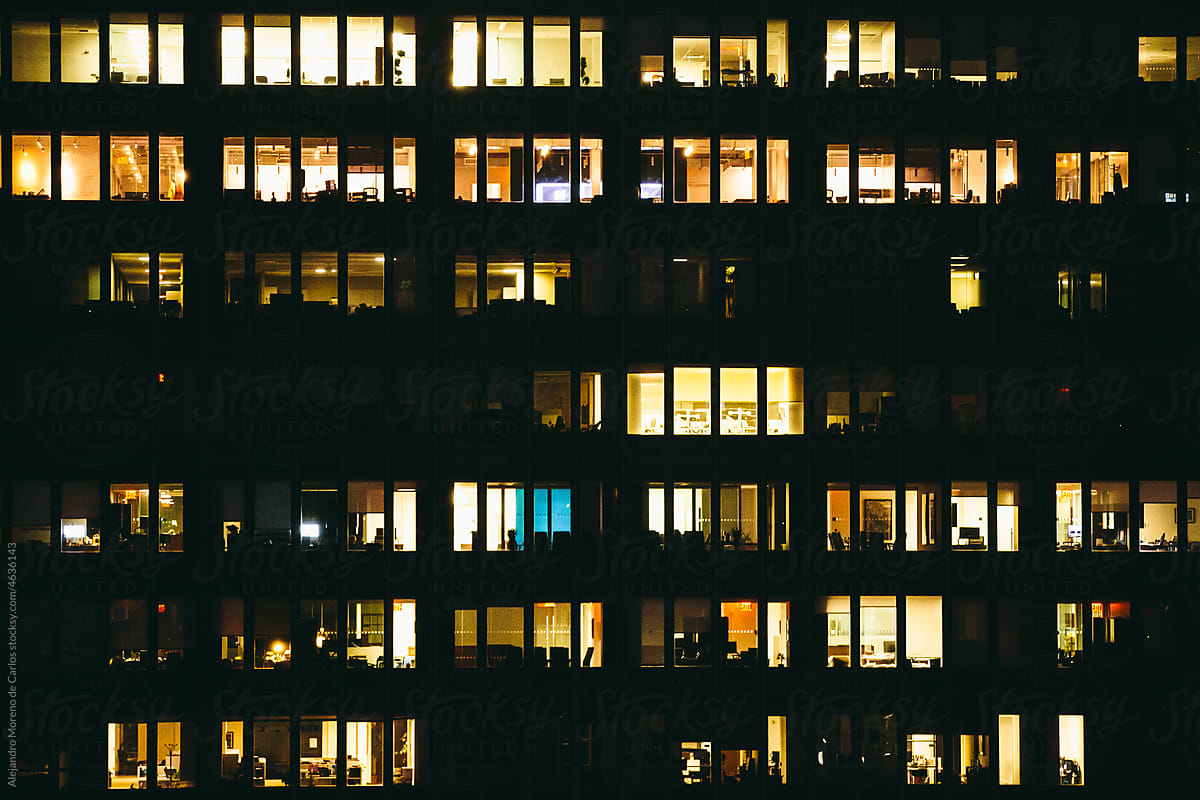 Shiny windows of office building at night