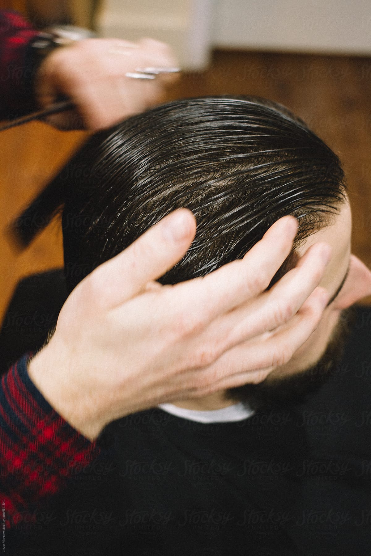 "Barber Cuts Young Male Hair" by Stocksy Contributor "Jesse Morrow