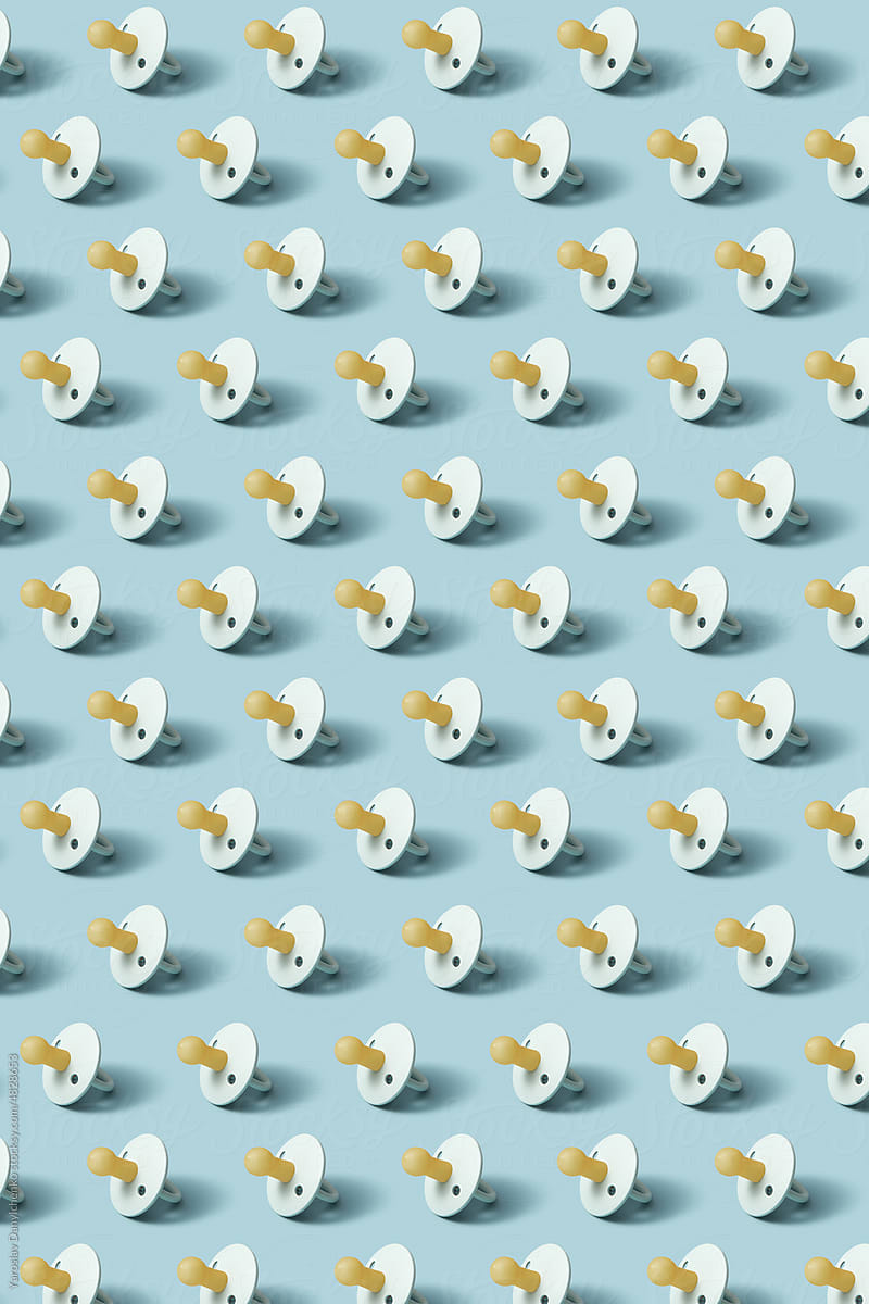 Pattern of baby pacifiers on blue background.