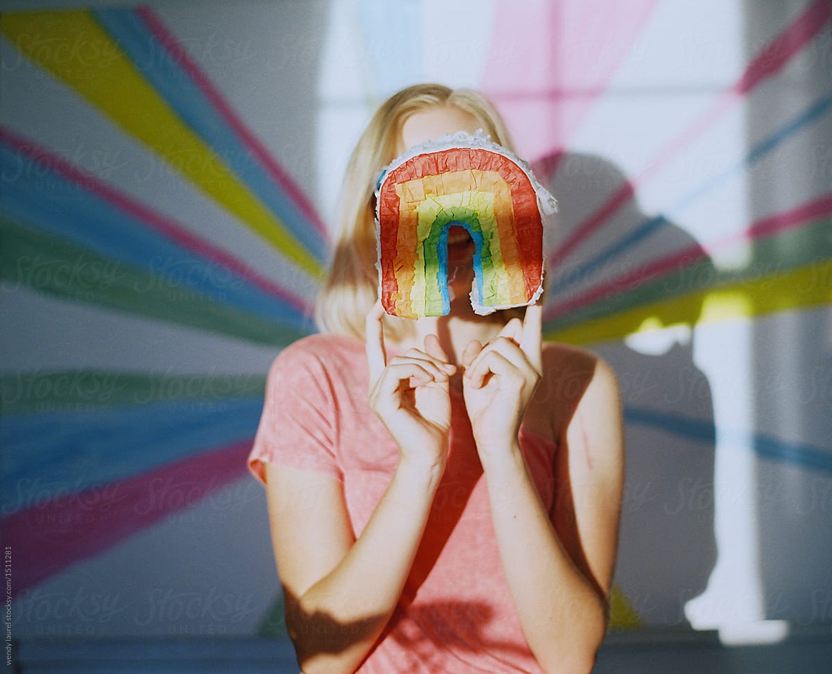 rainbow against rainbow teen girl portrait