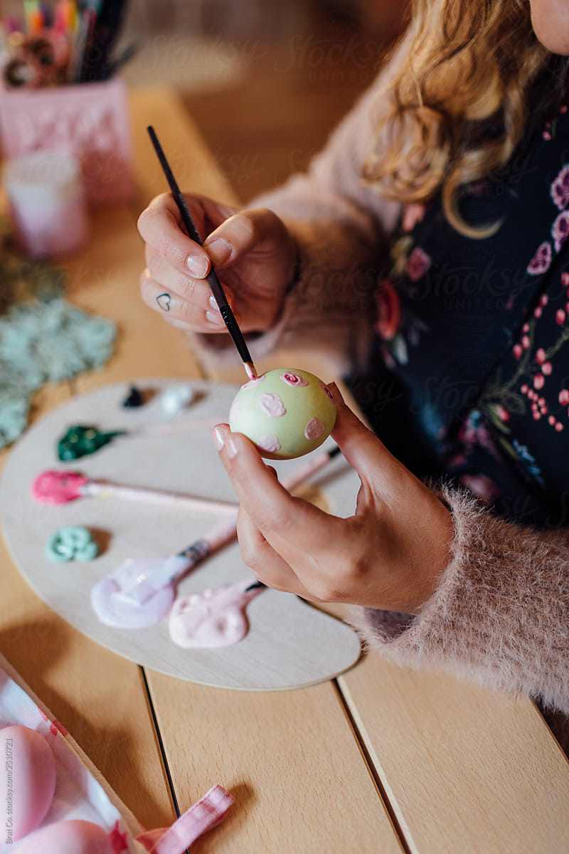 Woman Painting Easter Eggs