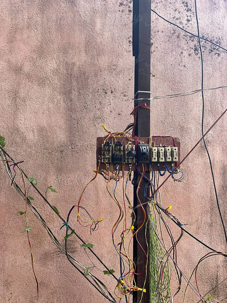 External switching system hanging in a rusted pole unsafely