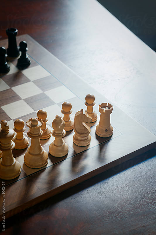 Wooden chess board on a wooden table