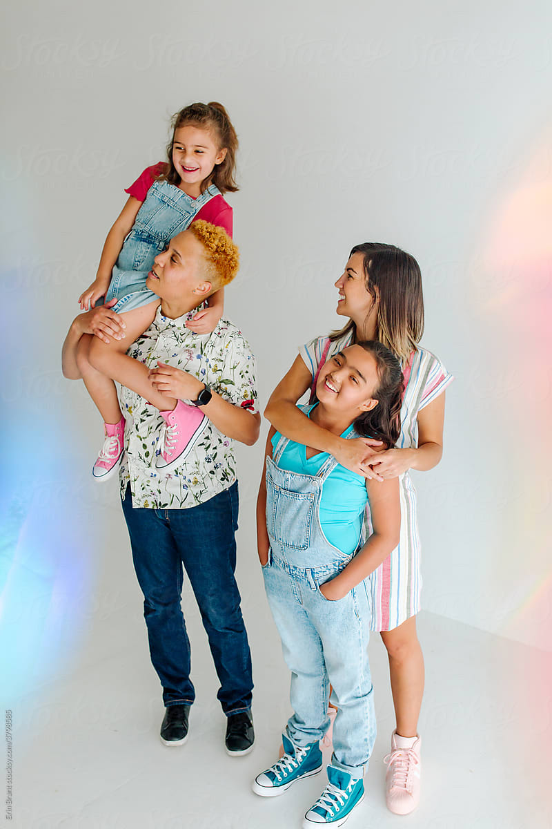 Lesbian couple with daughters in studio