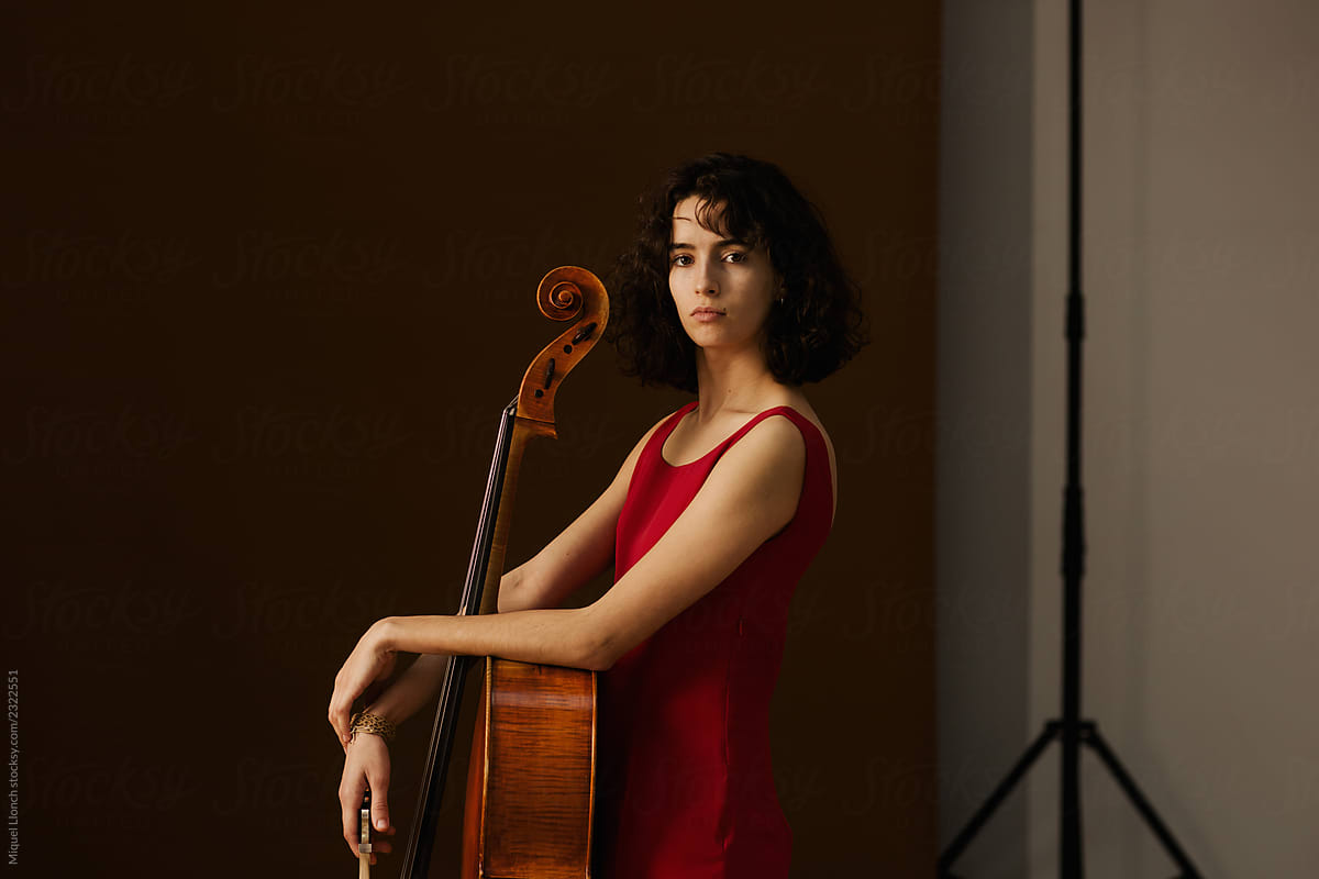 Beautiful young woman with cello