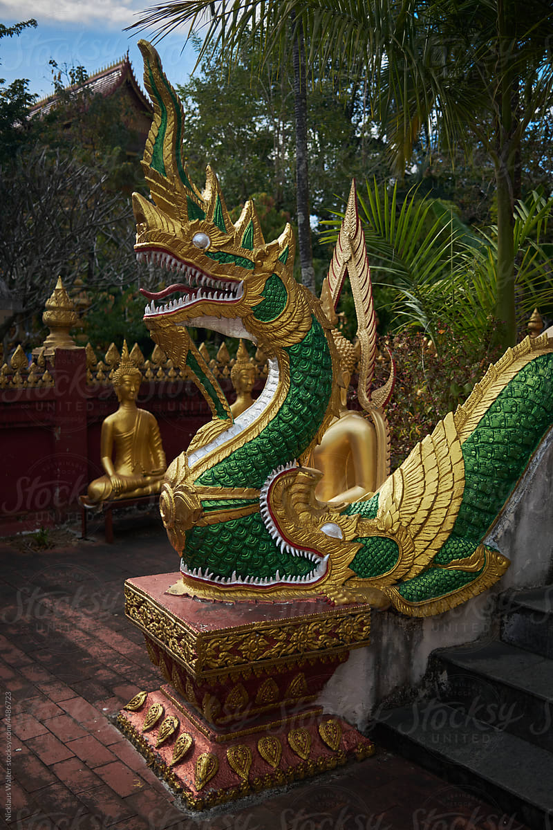 Detail Of A Golden Statue At A Temple In Xishuangbanna, Yunnan, China.