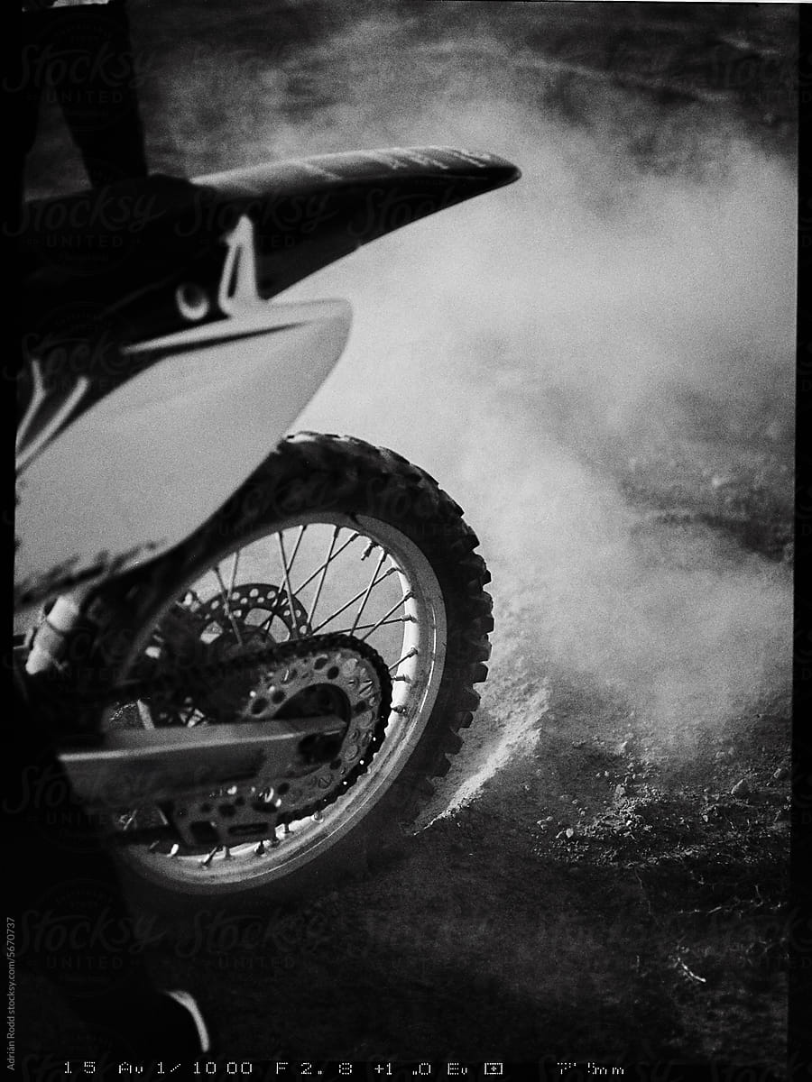 Speed Demon: Close-Up of Motocross Wheel in Rapid Motion