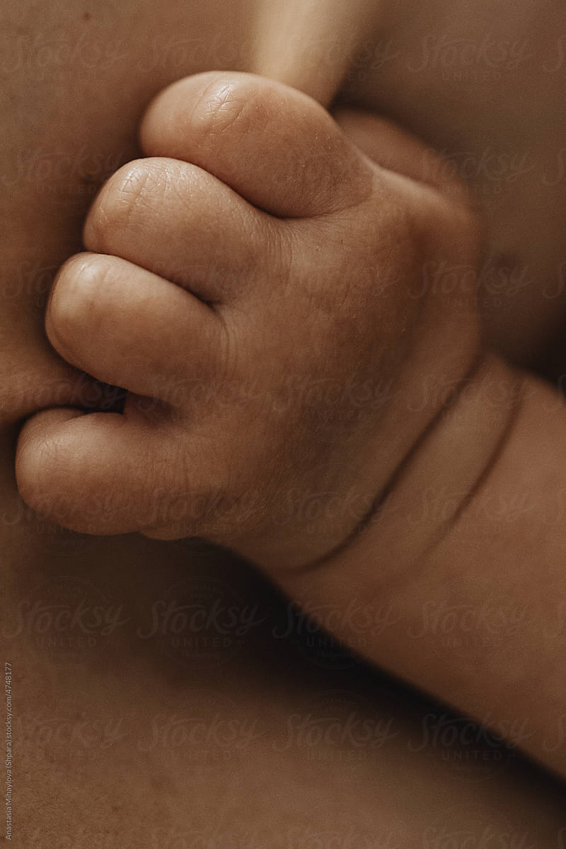 Close Up Vertical Shot Of A Baby\'s little Hand