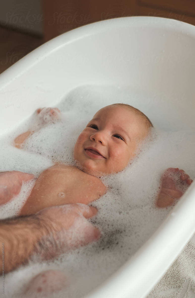 Smiling Baby Enjoying Bath Time