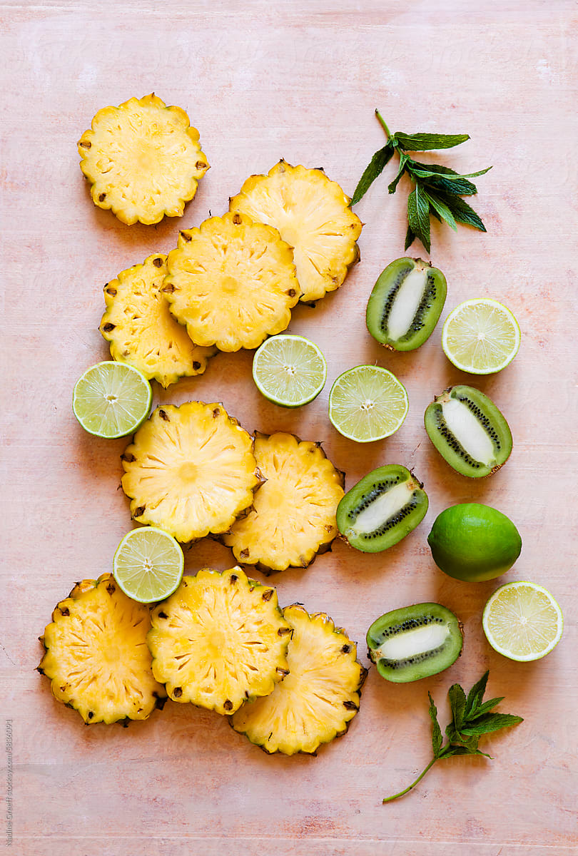 Tropical fruit, pineapple, limes and green kiwi fruit